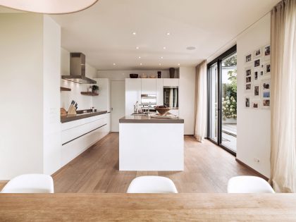 A Bright Modern Home with White Facade and Large Glass Windows in Uitikon, Switzerland by Meier Architekten (13)