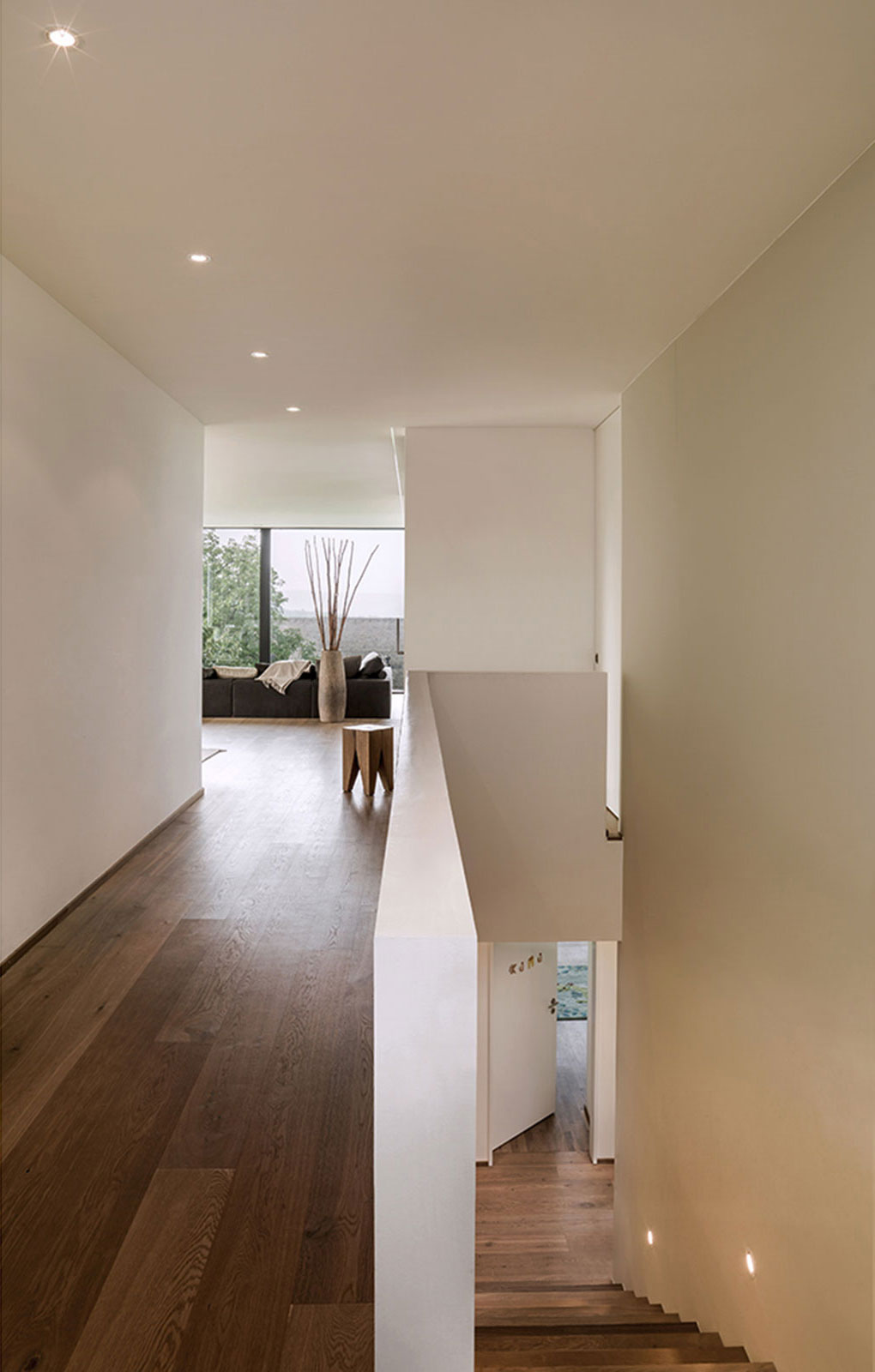 A Bright Modern Home with White Facade and Large Glass Windows in Uitikon, Switzerland by Meier Architekten (15)