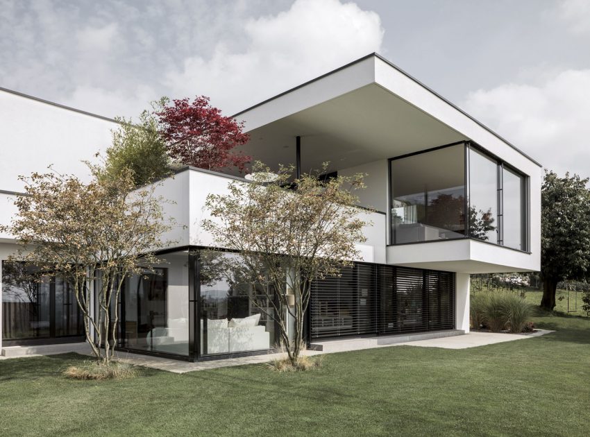 A Bright Modern Home with White Facade and Large Glass Windows in Uitikon, Switzerland by Meier Architekten (2)