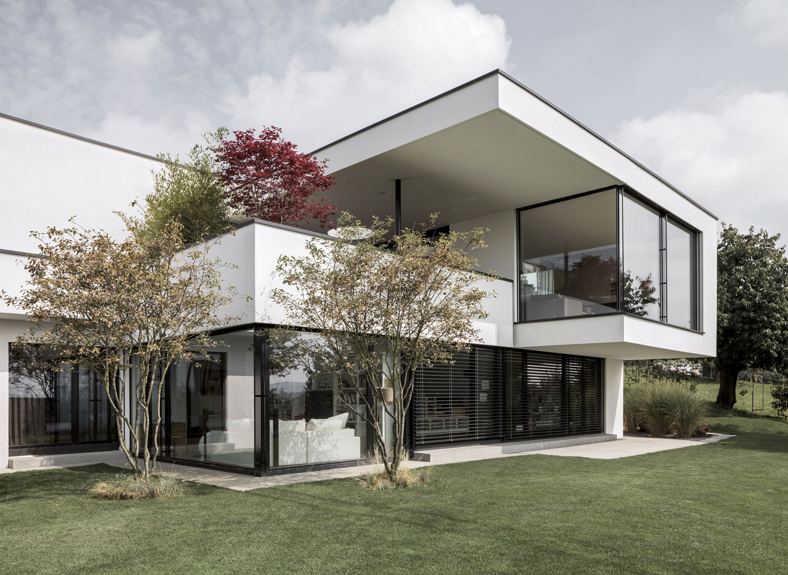 A Bright Modern Home with White Facade and Large Glass Windows in Uitikon, Switzerland by Meier Architekten (2)