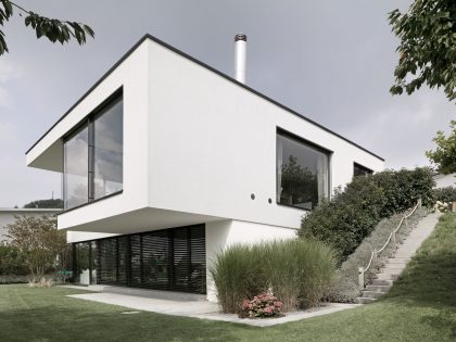 A Bright Modern Home with White Facade and Large Glass Windows in Uitikon, Switzerland by Meier Architekten (3)