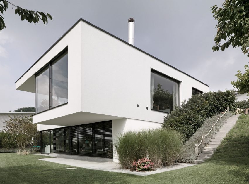 A Bright Modern Home with White Facade and Large Glass Windows in Uitikon, Switzerland by Meier Architekten (3)