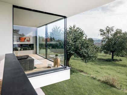 A Bright Modern Home with White Facade and Large Glass Windows in Uitikon, Switzerland by Meier Architekten (8)