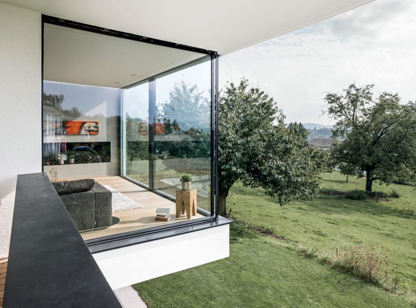 A Bright Modern Home with White Facade and Large Glass Windows in Uitikon, Switzerland by Meier Architekten (8)