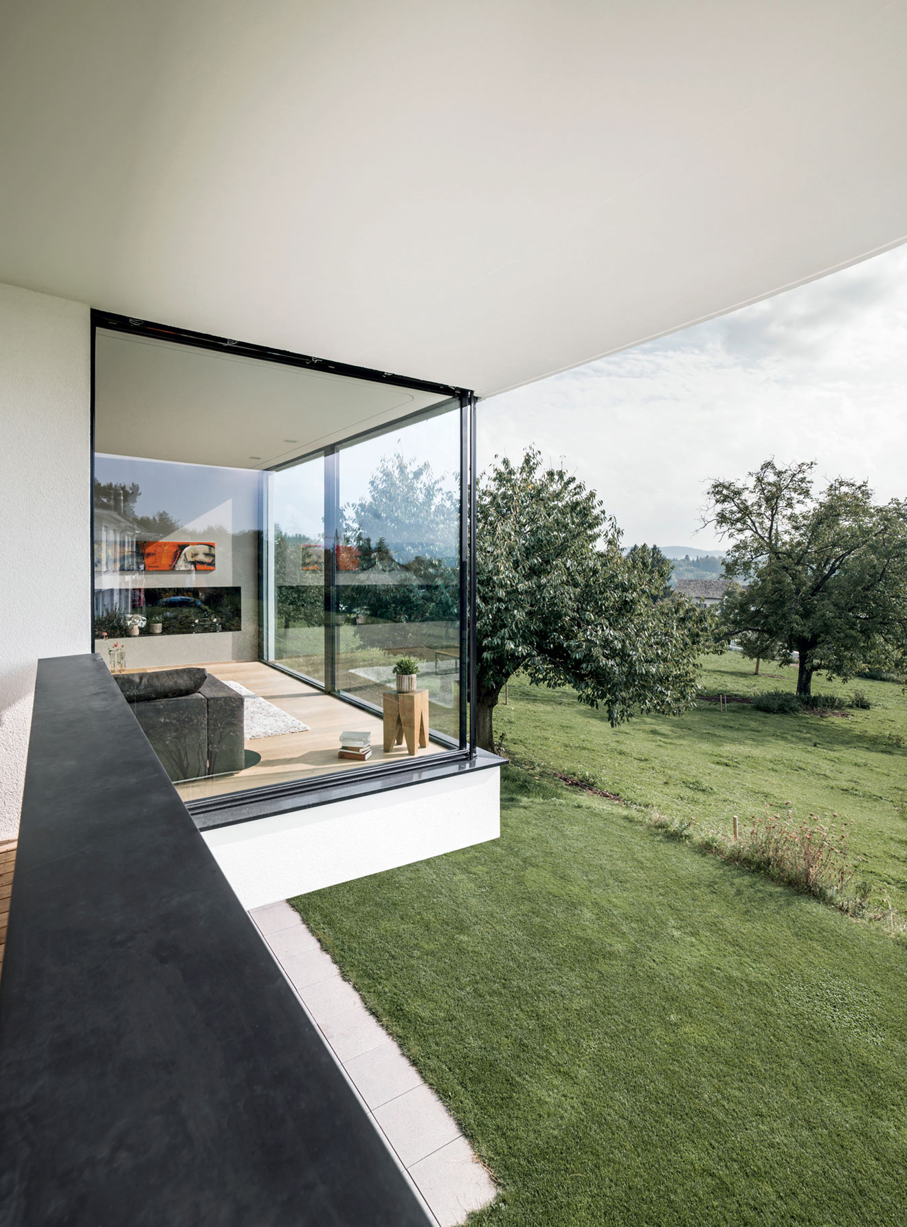 A Bright Modern Home with White Facade and Large Glass Windows in Uitikon, Switzerland by Meier Architekten (8)