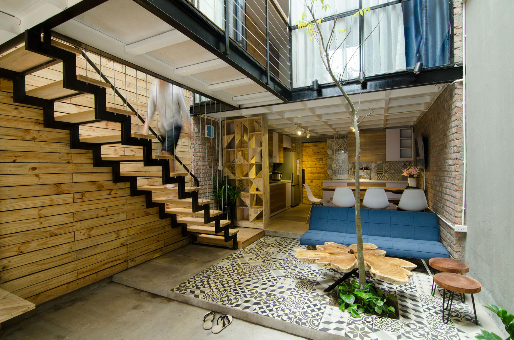 A Small Modern Home with Central Atrium and Rustic Vibe in Hoàng Văn Thái by Global Architects & Associates (2)