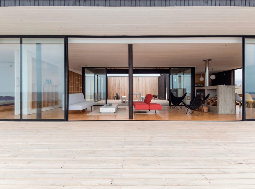 A Spacious Family-Friendly Home with Wood and Concrete Facade in Huentaleuquen, Chile by nüform (11)