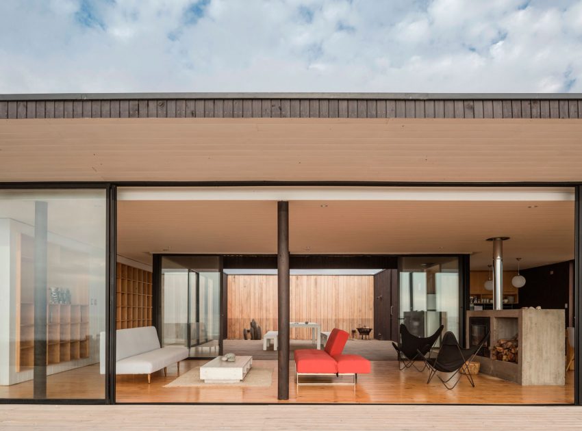 A Spacious Family-Friendly Home with Wood and Concrete Facade in Huentaleuquen, Chile by nüform (12)