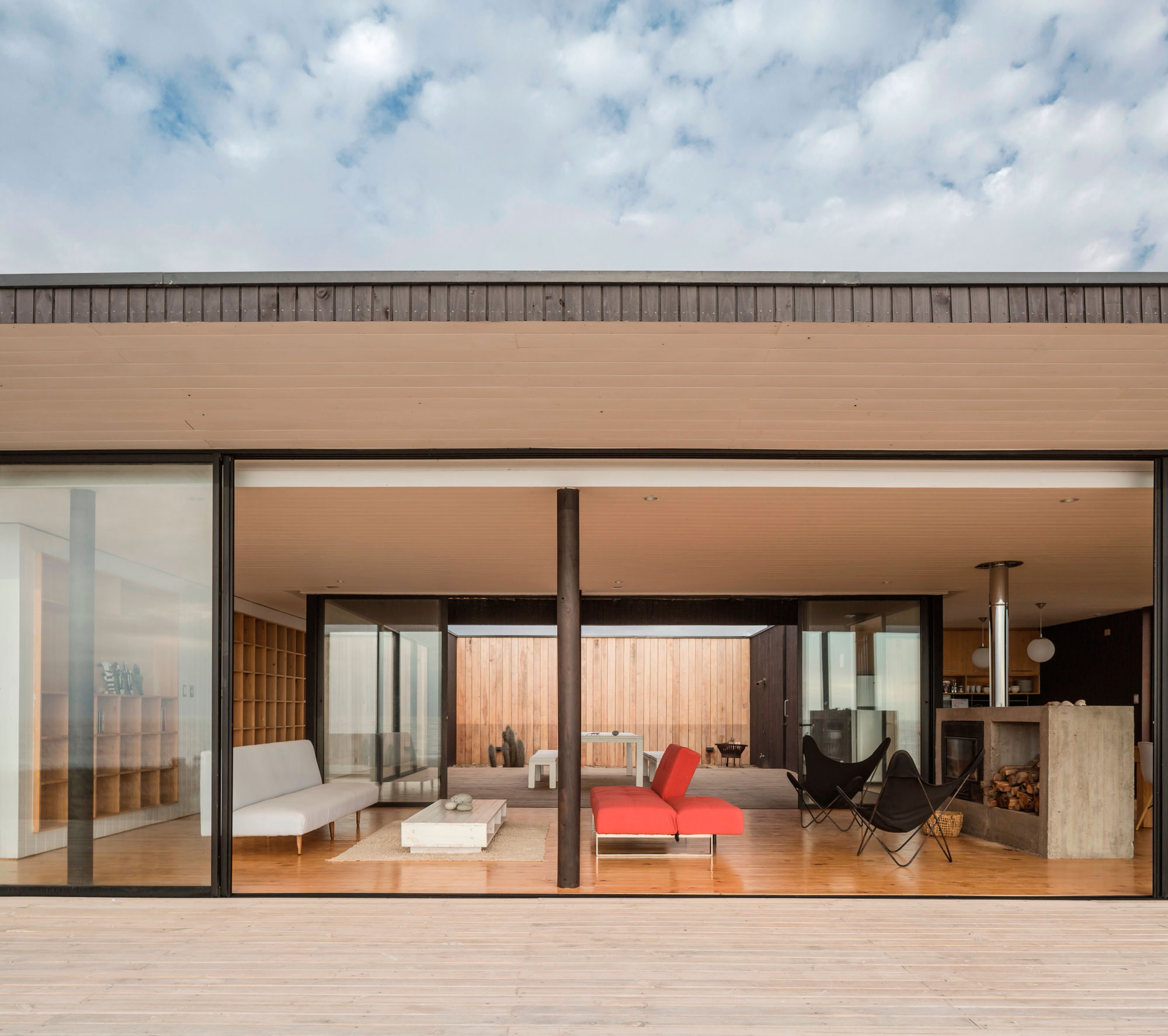 A Spacious Family-Friendly Home with Wood and Concrete Facade in Huentaleuquen, Chile by nüform (12)