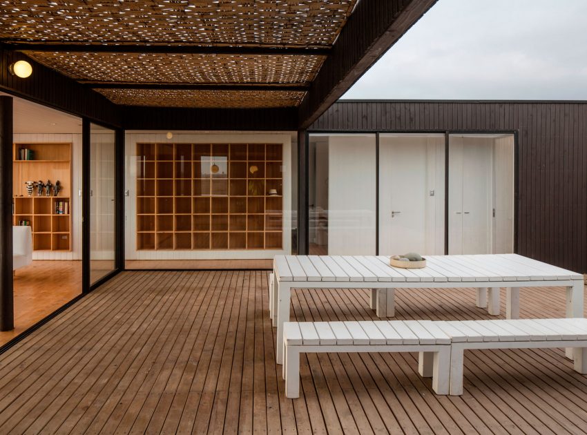 A Spacious Family-Friendly Home with Wood and Concrete Facade in Huentaleuquen, Chile by nüform (13)