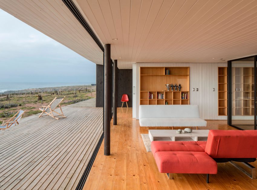 A Spacious Family-Friendly Home with Wood and Concrete Facade in Huentaleuquen, Chile by nüform (14)