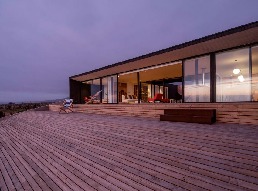 A Spacious Family-Friendly Home with Wood and Concrete Facade in Huentaleuquen, Chile by nüform (16)