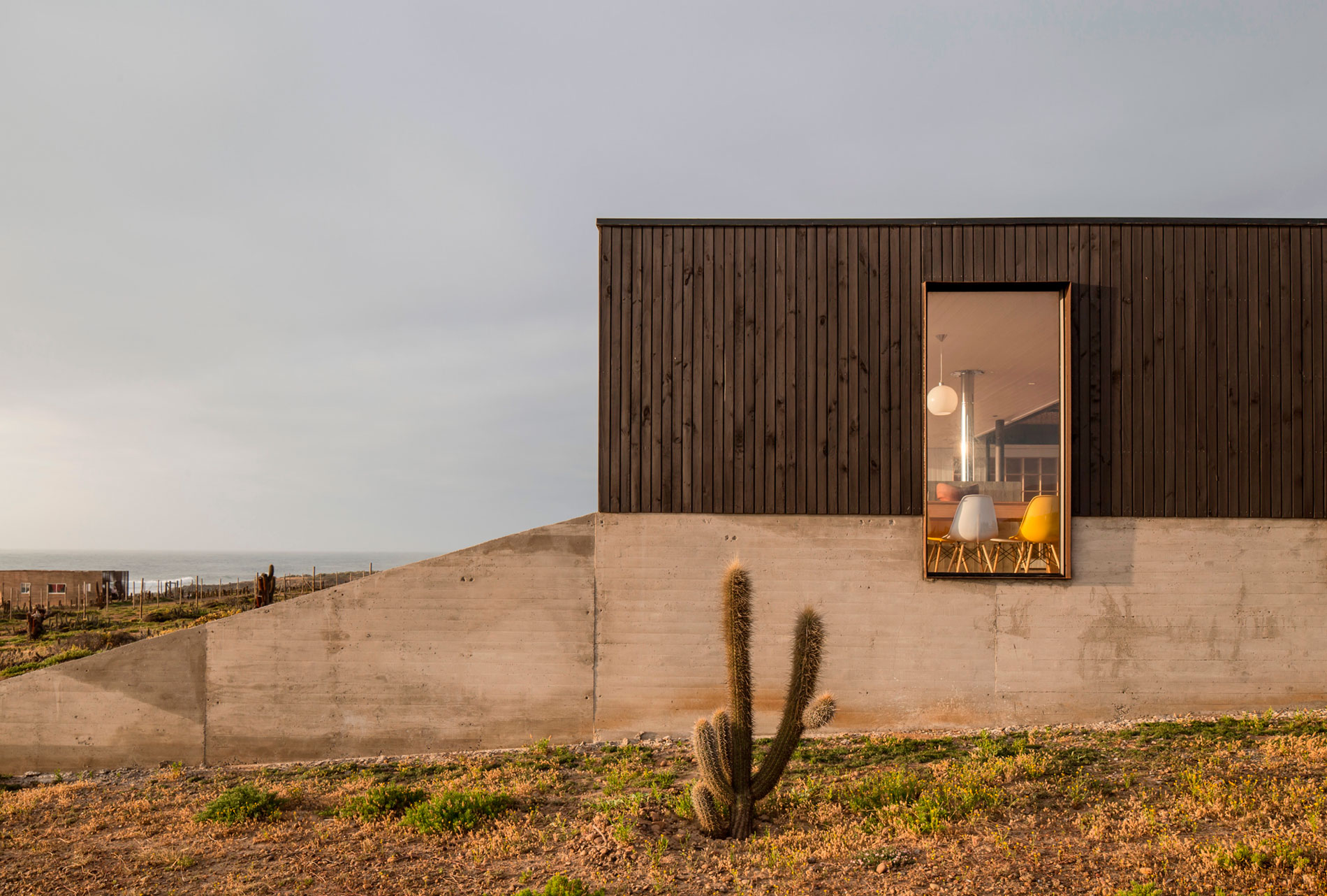 A Spacious Family-Friendly Home with Wood and Concrete Facade in Huentaleuquen, Chile by nüform (17)