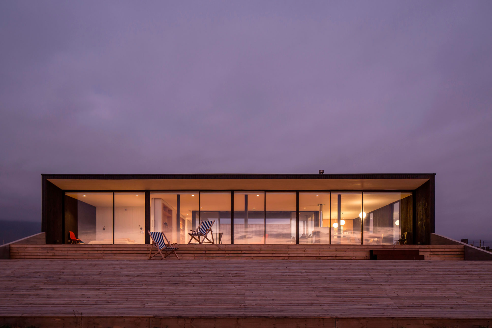 A Spacious Family-Friendly Home with Wood and Concrete Facade in Huentaleuquen, Chile by nüform (18)