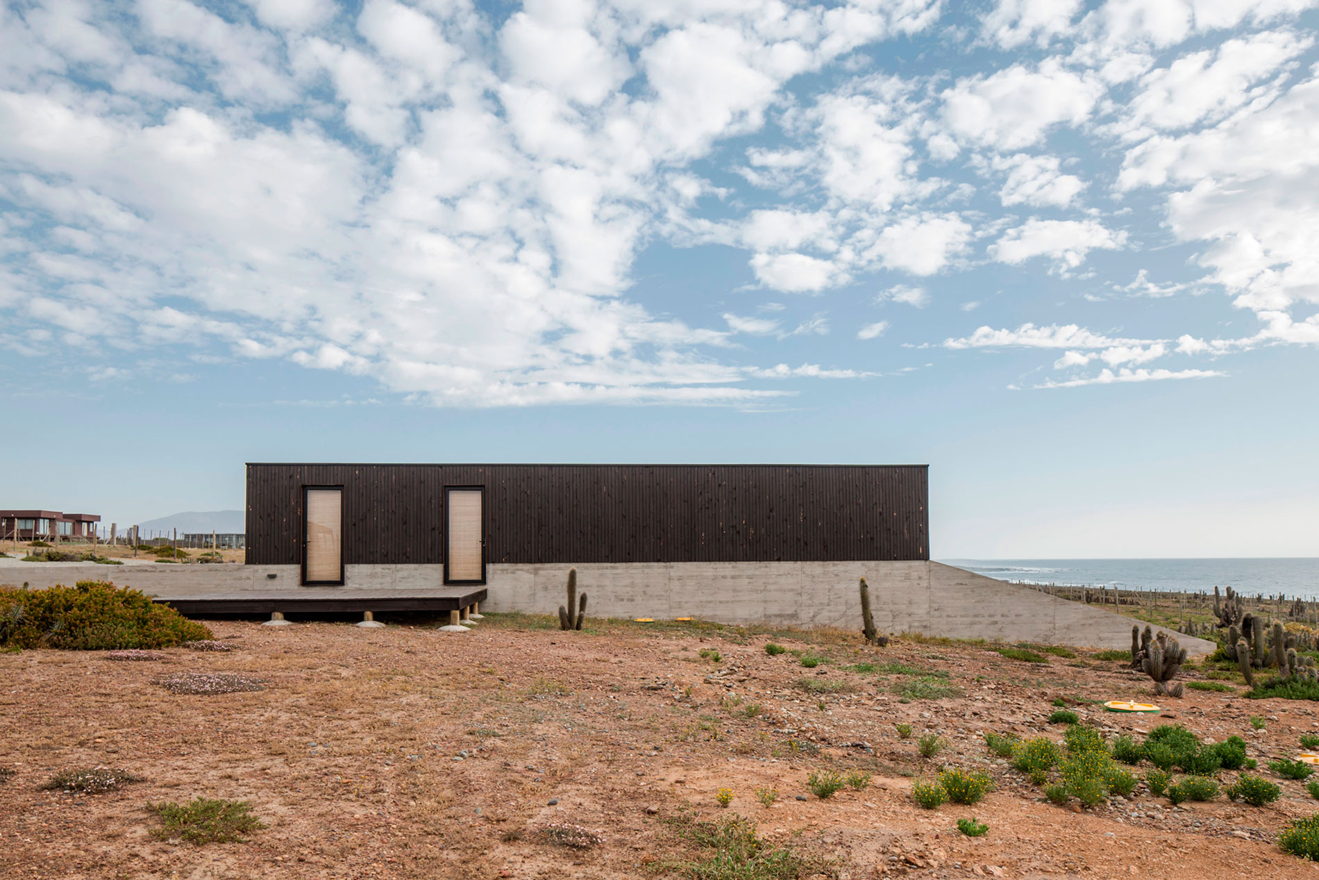 A Spacious Family-Friendly Home with Wood and Concrete Facade in Huentaleuquen, Chile by nüform (2)