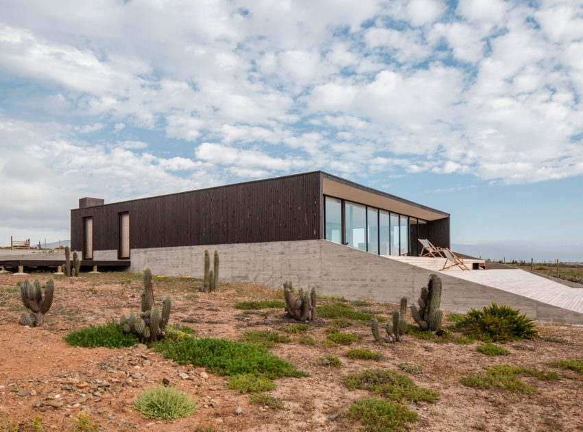 A Spacious Family-Friendly Home with Wood and Concrete Facade in Huentaleuquen, Chile by nüform (3)