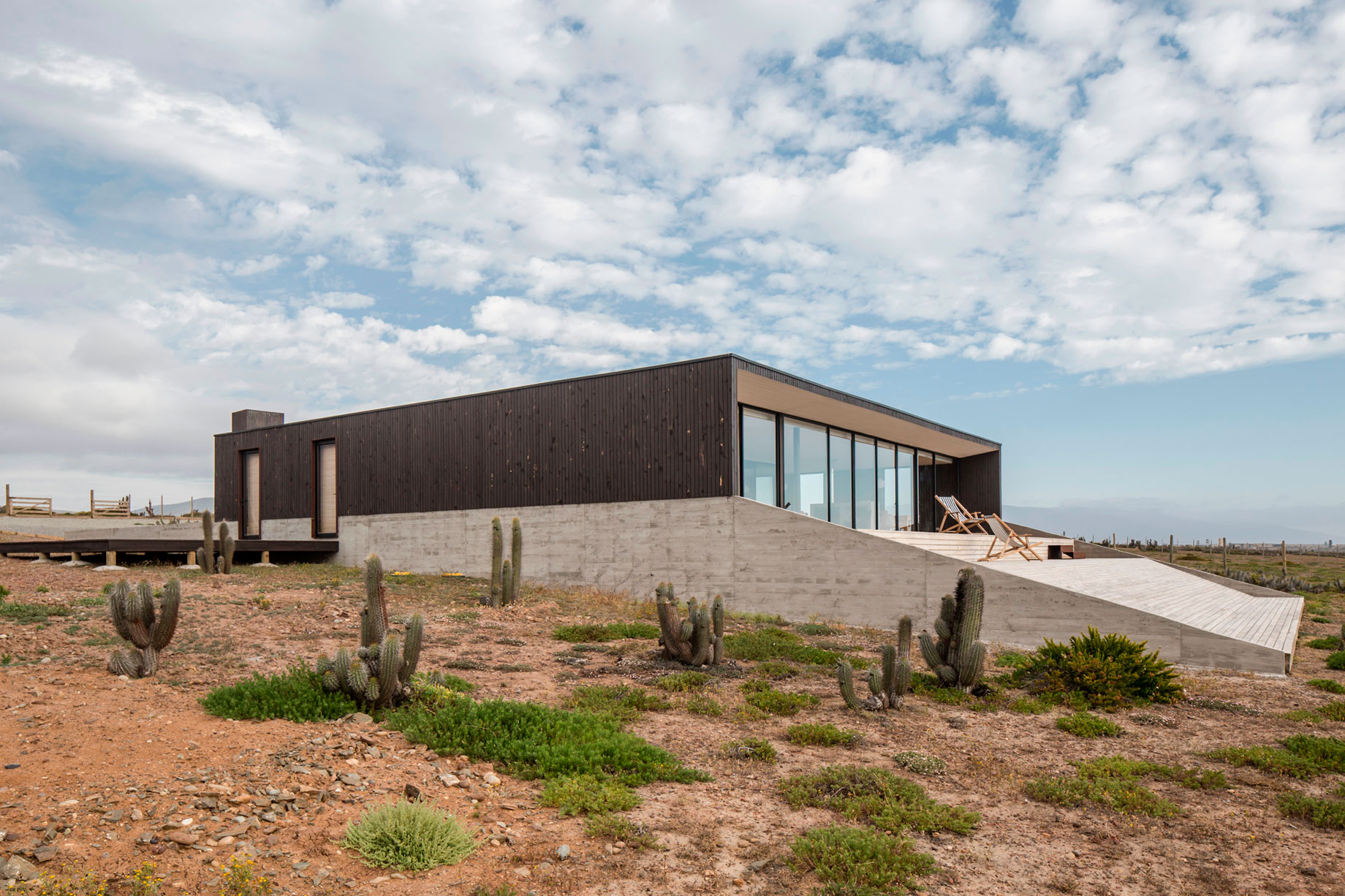 A Spacious Family-Friendly Home with Wood and Concrete Facade in Huentaleuquen, Chile by nüform (3)