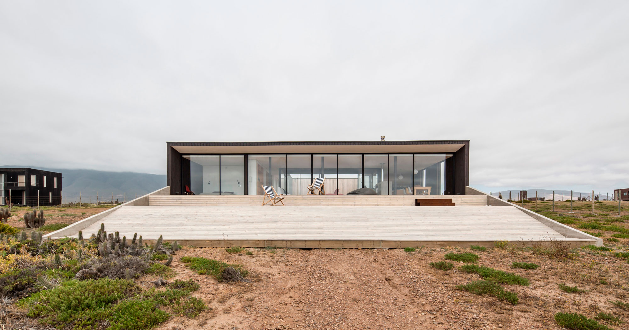 A Spacious Family-Friendly Home with Wood and Concrete Facade in Huentaleuquen, Chile by nüform (5)