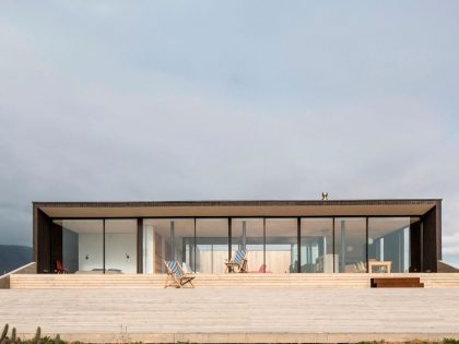 A Spacious Family-Friendly Home with Wood and Concrete Facade in Huentaleuquen, Chile by nüform (6)