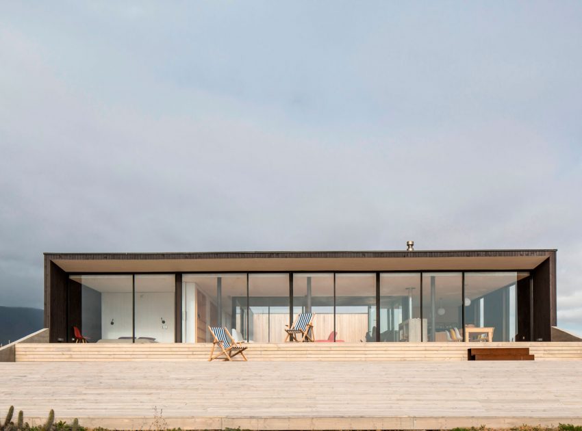 A Spacious Family-Friendly Home with Wood and Concrete Facade in Huentaleuquen, Chile by nüform (6)