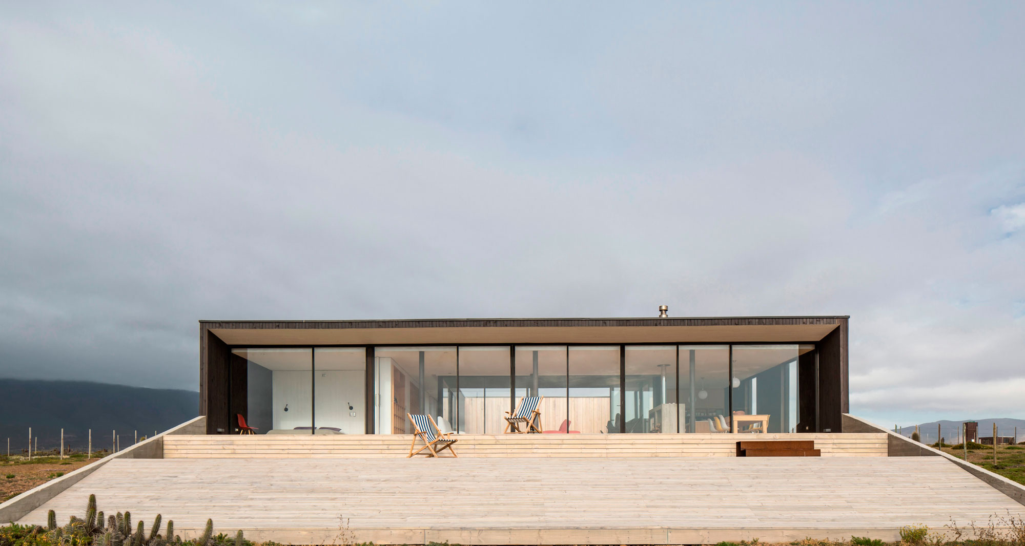 A Spacious Family-Friendly Home with Wood and Concrete Facade in Huentaleuquen, Chile by nüform (6)