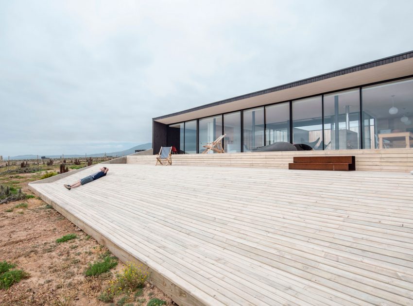 A Spacious Family-Friendly Home with Wood and Concrete Facade in Huentaleuquen, Chile by nüform (7)