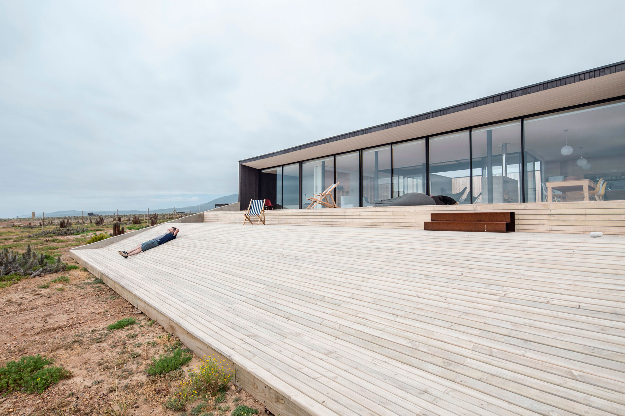 A Spacious Family-Friendly Home with Wood and Concrete Facade in Huentaleuquen, Chile by nüform (7)