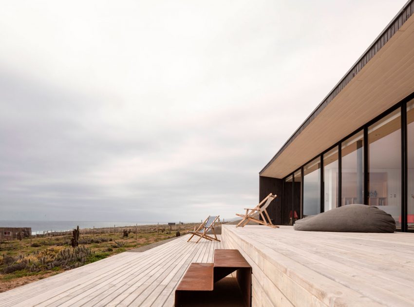 A Spacious Family-Friendly Home with Wood and Concrete Facade in Huentaleuquen, Chile by nüform (8)