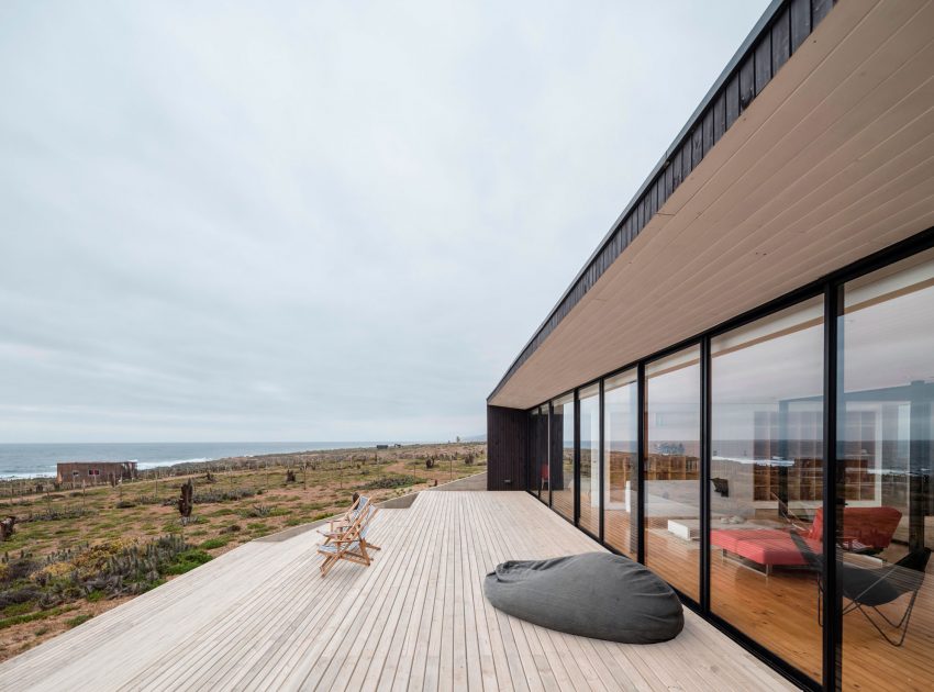 A Spacious Family-Friendly Home with Wood and Concrete Facade in Huentaleuquen, Chile by nüform (9)