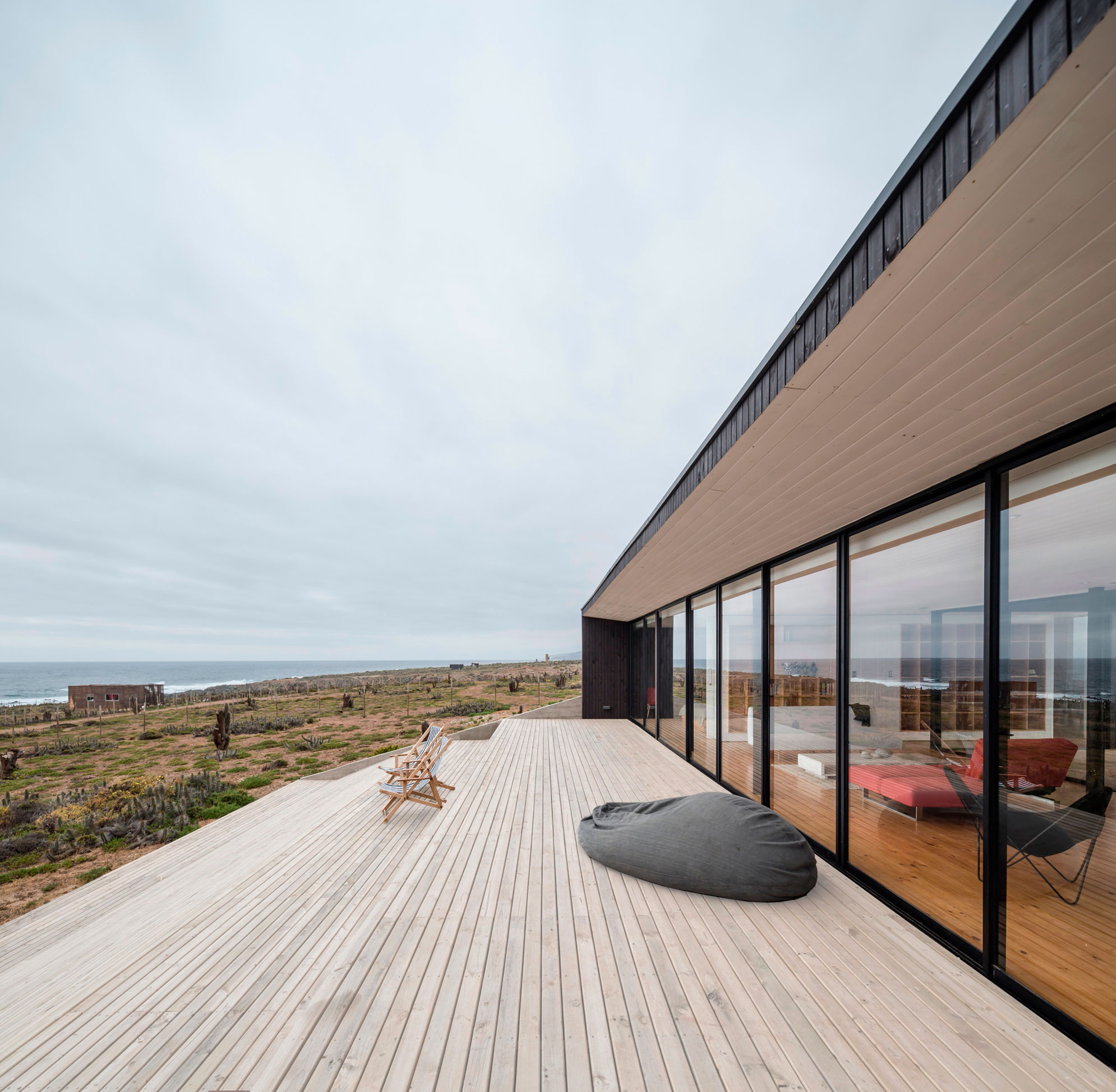 A Spacious Family-Friendly Home with Wood and Concrete Facade in Huentaleuquen, Chile by nüform (9)
