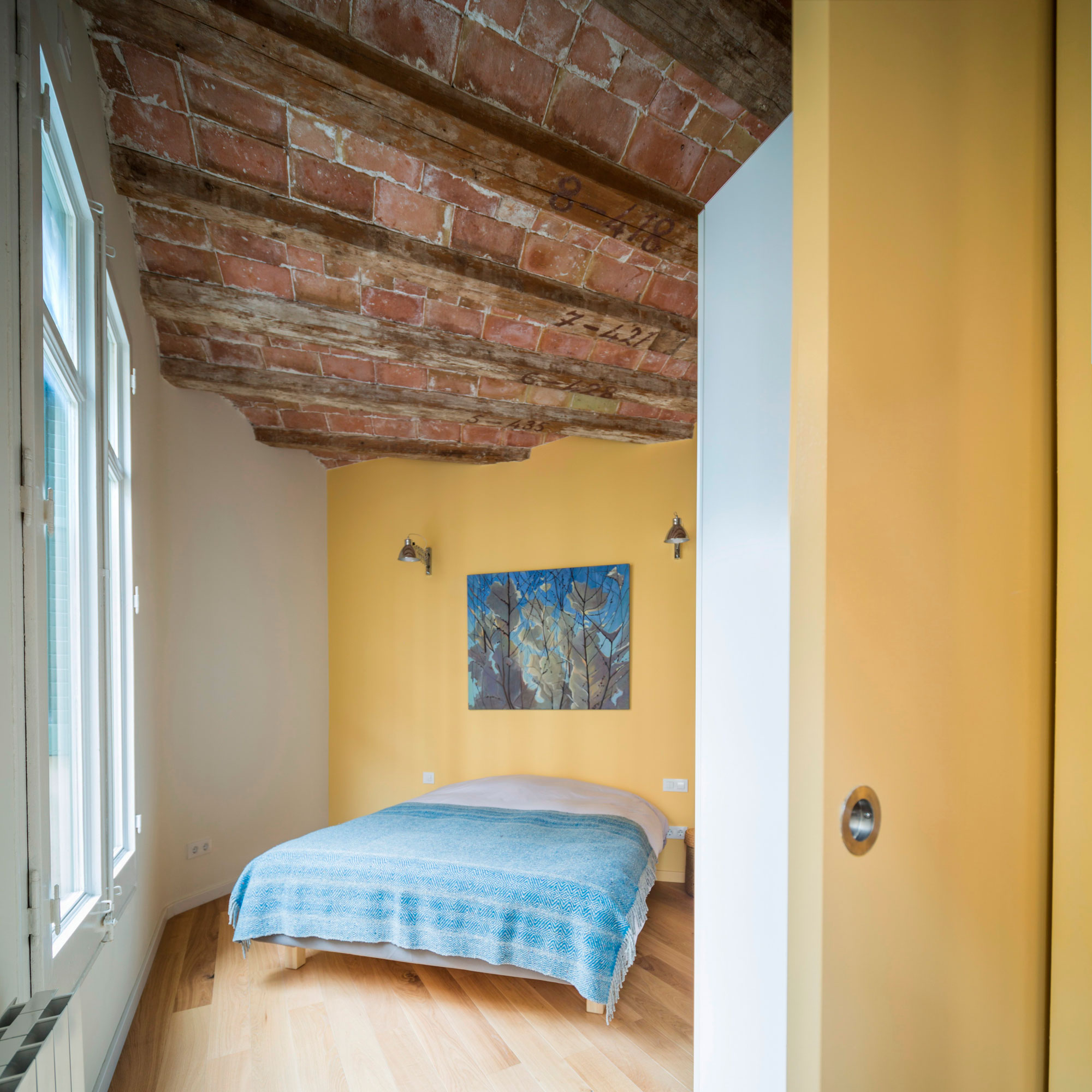 A Striking and Warm Apartment Drenched in Natural Light and Character in Barcelona, Spain by Nook Architects (15)