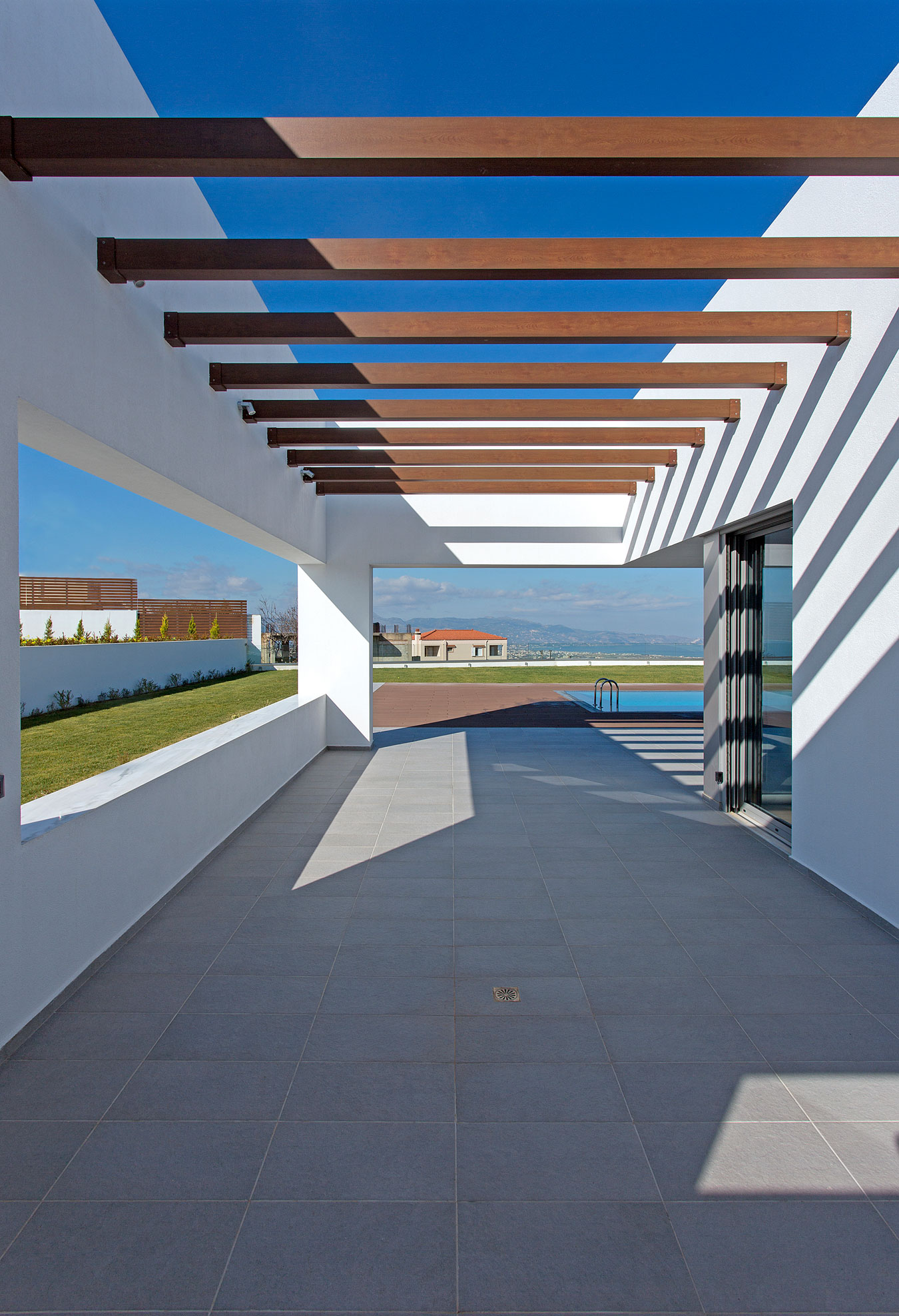 A Stylish and Bright L-Shaped Home with Playful Interiors in Crete, Greece by 3+ architecture (4)