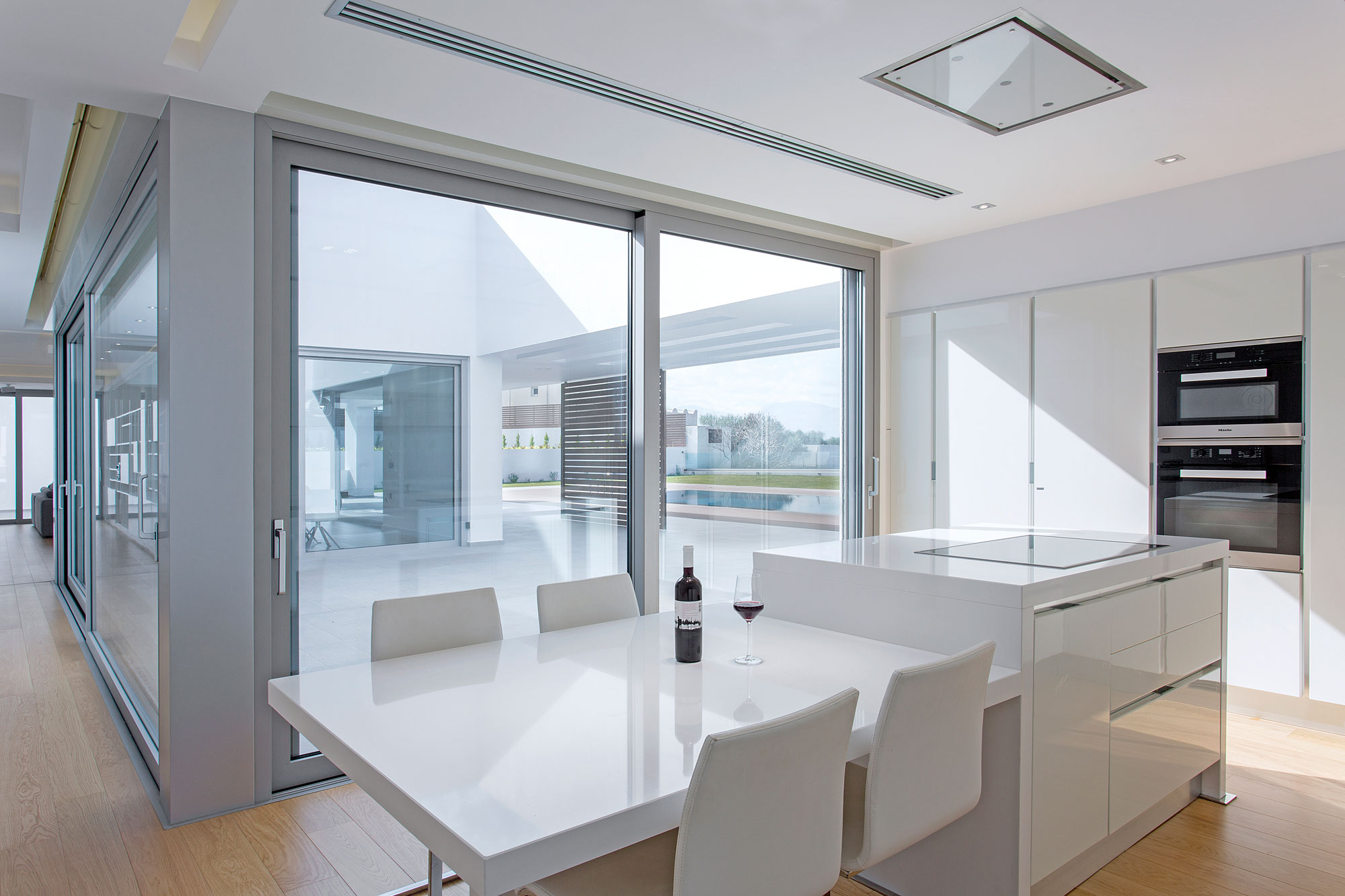 A Stylish and Bright L-Shaped Home with Playful Interiors in Crete, Greece by 3+ architecture (6)