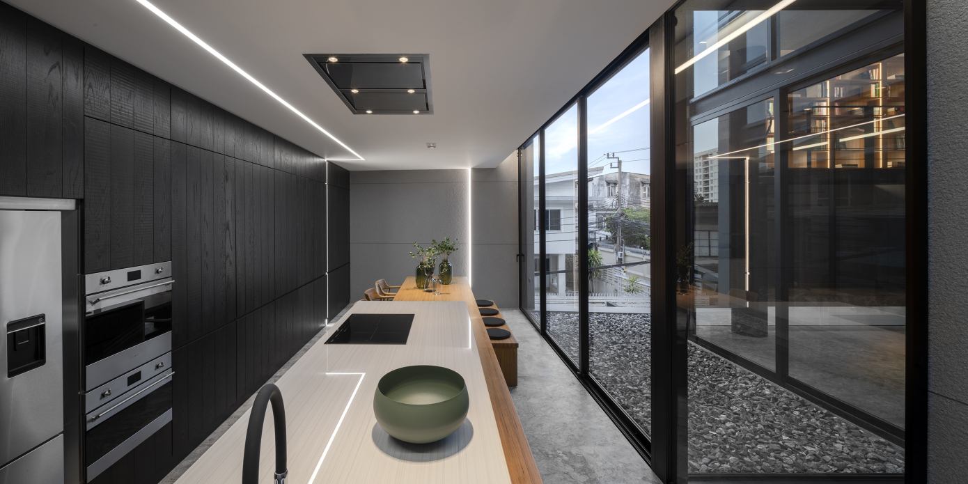 A Contemporary House Made of Wood, Concrete, Steel, Glass and Stone in Bangkok, Thailand by Kuanchanok Pakavaleetorn Architects (8)