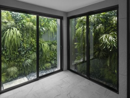 A Contemporary House Made of Wood, Concrete, Steel, Glass and Stone in Bangkok, Thailand by Kuanchanok Pakavaleetorn Architects (9)