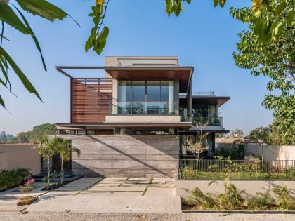 A Modern Three-Story Concrete House with a Stunning Staircase in Ahmedabad, India by Inclined Studio (1)