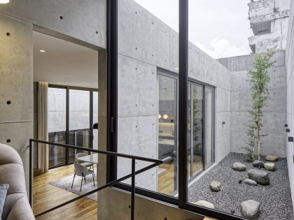 A Stunning Concrete Home for a Couple and Two Children in Semarang, Indonesia by Tamara Wibowo Architects (15)