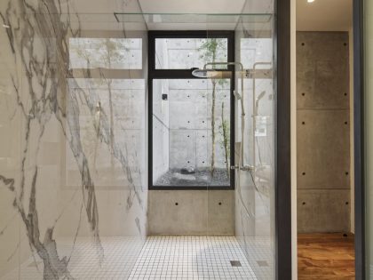 A Stunning Concrete Home for a Couple and Two Children in Semarang, Indonesia by Tamara Wibowo Architects (17)