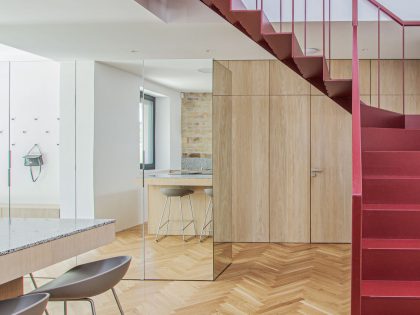 An Eclectic Apartment with Steel Staircase and Brick Walls in Bratislava